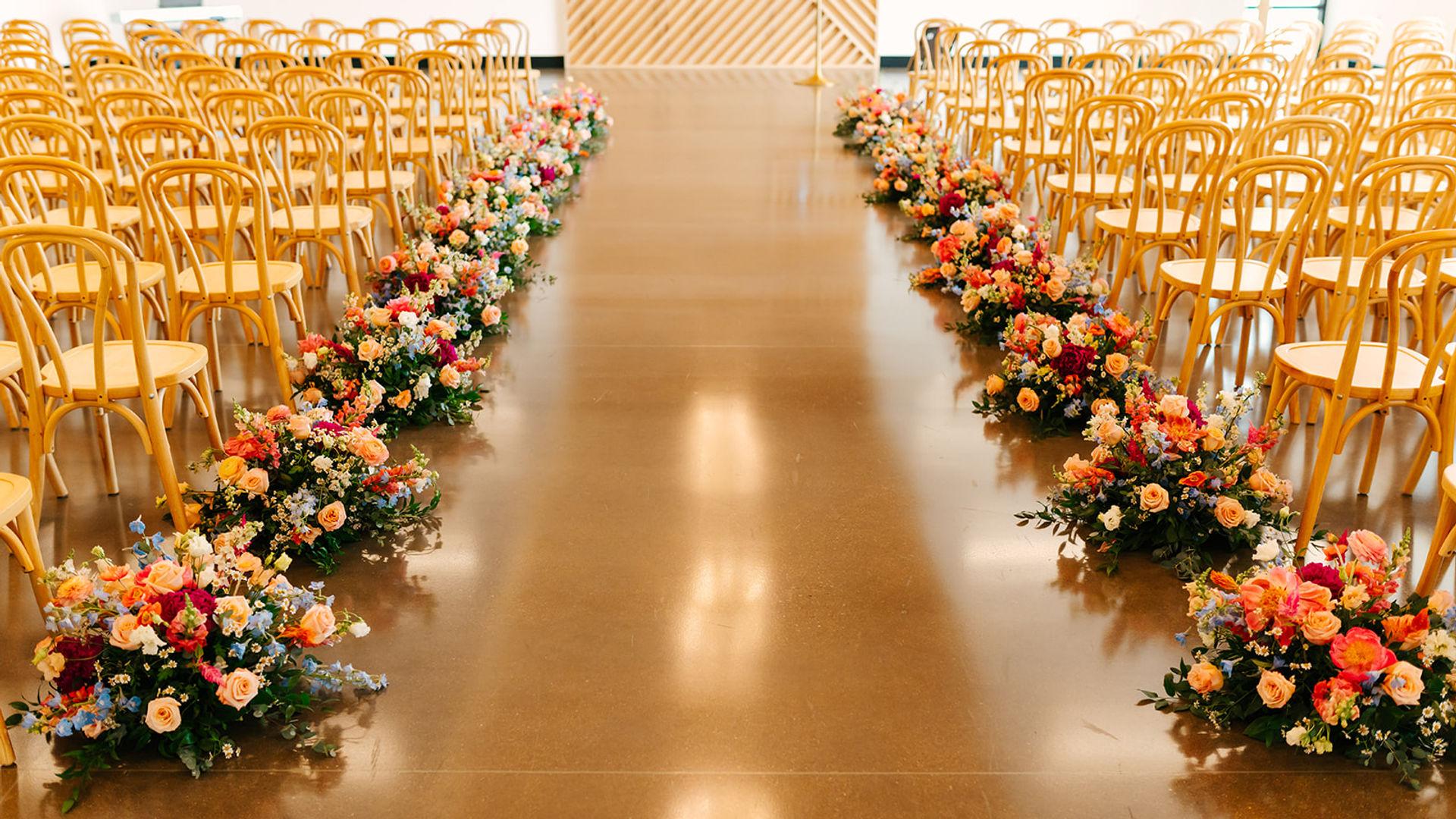 Floral-lined wedding ceremony aisle